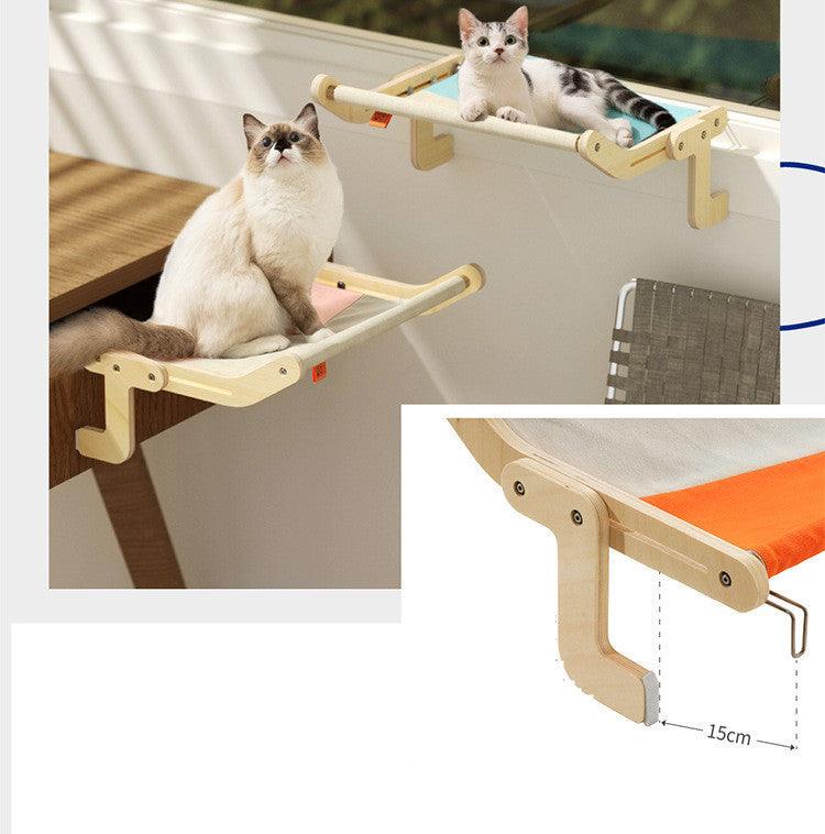 Dual cat hanging beds with wooden frames and soft fabric, mounted on a window for an elevated and comfortable lounging experience.