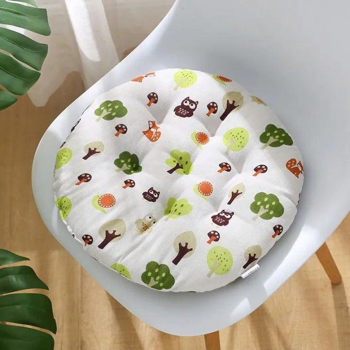 Round cat cushion with a forest-themed print, designed as an optional accessory for the macrame cat swing bed.