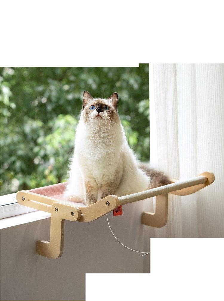 Elegant cat hanging bed with a wooden frame and soft fabric, attached to a window for a high vantage point. Available in multiple colors.